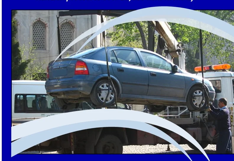 Vehicle being lifted by a tow truck